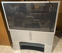 Front view of Sony rear-projection TV on matching stand