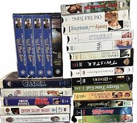 Full lot showing We’ll Meet Again box set, clamshells, and standard tapes stacked