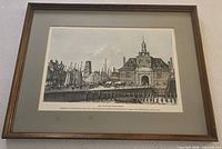 Full view of framed print showing image, mat, and wooden frame