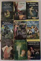 Front covers of all nine Nancy Drew books