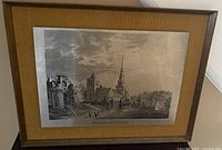 Front view of framed steel etching showing artwork, mat, and frame