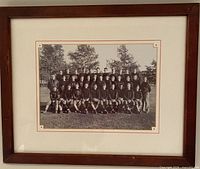 Front view of framed sports team photo reprint