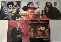 Front covers of all five vinyl albums laid out