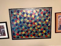 Full view of framed abstract print on wall