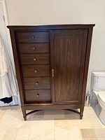 Front view of chiffarobe showing drawers and door