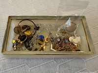 Tray containing assorted jewellery pieces