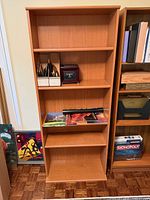 Front view of full bookcase displaying shelves and finish