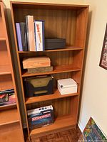 Front view of full bookcase with shelves