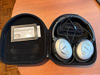 Headphones, cable, case interior and instruction card