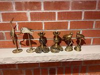 Full set of six brass pieces on mantel