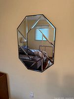 Full view of octagonal mirror on wall