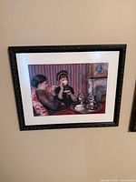 Full view of framed print on wall
