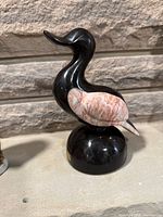 Full view of onyx duck sculpture left profile