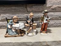 Front view of all three porcelain figurines