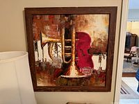 Full view of framed painting on wall