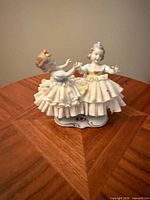 Front view of Unterweissbach porcelain figurine showing two girls in lace dresses
