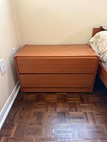Nightstand front view showing drawers and finish