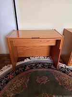 Front angled view of teak vanity table