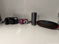 Group view of all four items: two cameras and two speakers