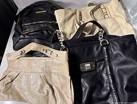 Group shot of four handbags