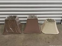 Three fabric lamp shades side by side