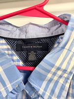 Tommy Hilfiger label and blue plaid fabric