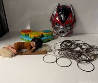 Group shot: doll, tray, mask, bangles, ruler