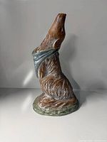 Full view of ceramic howling dog figurine