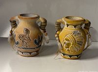 Front view of both vases showing painted motifs and handle details