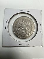 Obverse showing coat of arms in cardboard flip