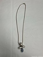 Full view of necklace showing chain length and pendant