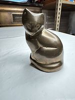 Front view of solid brass cat figurine
