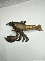Top view showing lobster form and brass patina