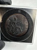 Reverse side of George V penny showing Britannia and denomination