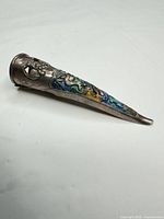 Side view highlighting cloisonné enamel decoration