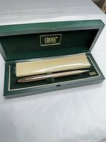 Pen inside open Cross presentation box showing sleeve and interior