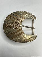 Front view showing overall shape, mixed metals and engraving