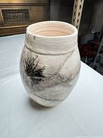 Full view of vase front showing decoration and form