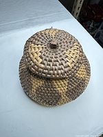 angled view of closed basket showing lid and weave pattern