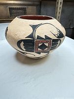 Full view of bowl showing overall shape and painted motif