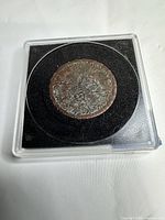 Coin in slab overall view