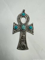 Front view showing Ankh shape, four turquoise stones, Egyptian motifs