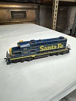 Right side view of blue and yellow Santa Fe 5628 locomotive