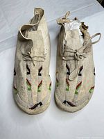 Top view of both moccasins showing beadwork and condition