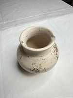 Top and side view of vase showing shape, color, markings and rim chip