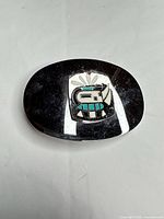 Front view of belt buckle showing full design and shape