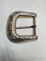 Front view showing floral engraving and rope edge detail