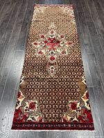 Full view of entire rug showing design, colors and overall condition