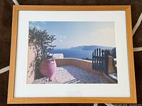Front view of framed Santorini photograph