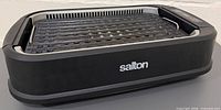 Overall view of Salton smokeless grill with ridged plate installed